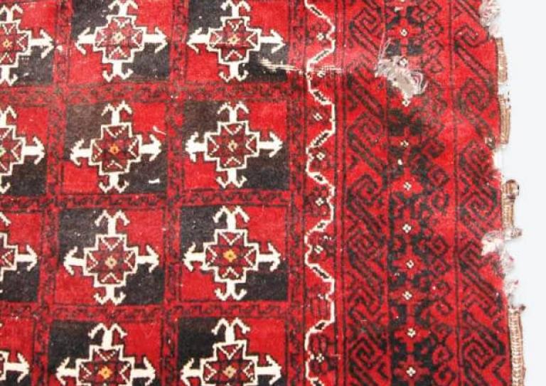 Baluch rug repair before Baluch rug repair