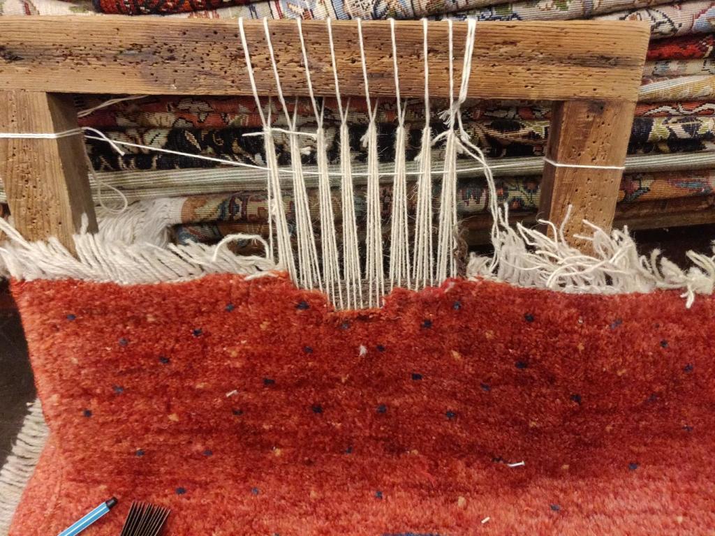 This is a link for fringe repair- Persian Qashqai Gabbeh rug-This rug was subject to severe moth damage, causing the fringes to deteriorate. We Thus had to start our extensive fringe weaving process. In this case we had to weave a pile back into the rug and secure the newly woven fringes.